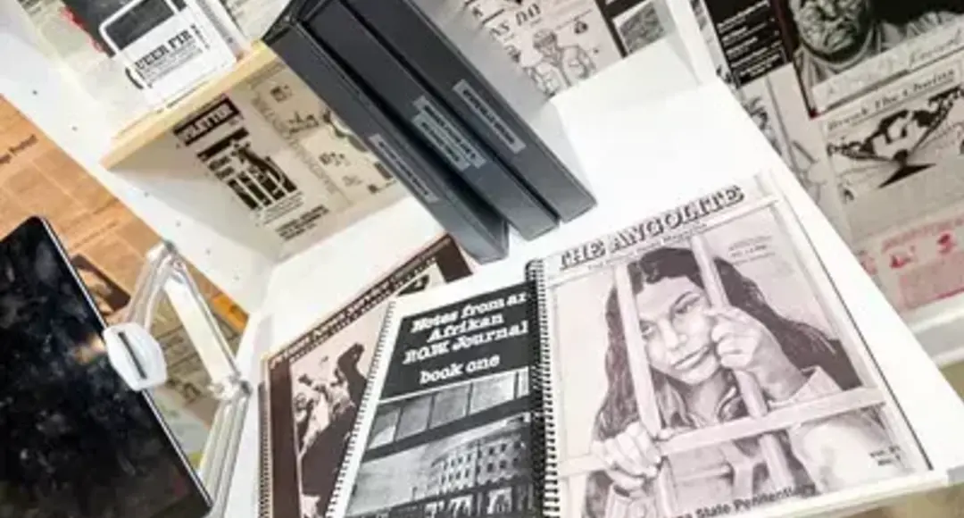 "The Angolite" magazine cover shows a black and white drawing of a woman behind prison bars; also "Notes from an Afrikan BOW Journal."